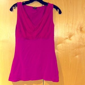 Pink sleeveless top.